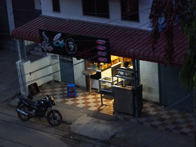 Street cafe setting up for opening just before sunrise
