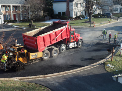 Laying the second layer of asphalt