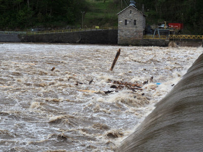 The flooding river flows over Dam 4