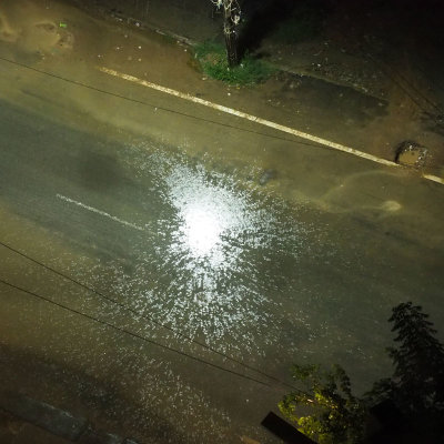 Reflection of street lamp light in the rain