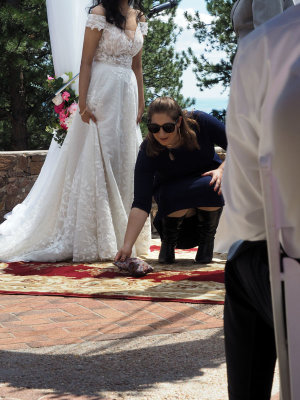 Laying down the glass to be broken during the wedding