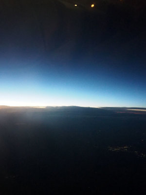 Sun setting behind the aircraft