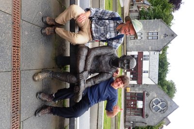 Posing with sculpture