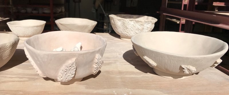 hand built bowls with embossed leaves.