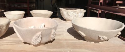 hand built bowls with embossed leaves.