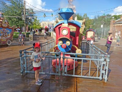 Maddie with Thomas the Train at the Magic Kingdom