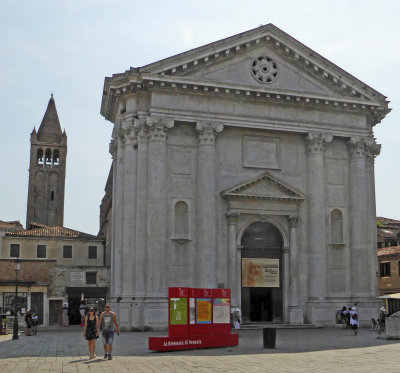 The Church of Saint Barnabas with its 11th Century belltower on the left