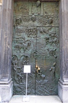 Bronze front door on St. Nicholass Church depicts Slovenian history