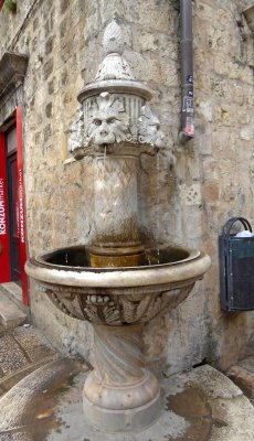 A lion fountain on Gundulic Square inside the walls of Old Town Dubrovnik