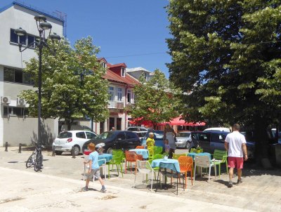 Outdoor tables from restaurant across the street in Cetinje, Montenegro