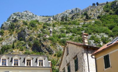 The Church of Our Lady of Remedy (1518) and city walls on the slope of the St. John Mountain above Kotor, Montenegro