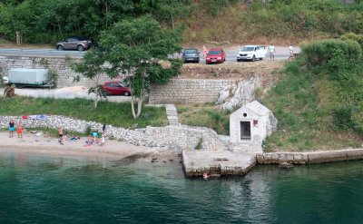 Small beach along the Bay of Kotor viewed from Aqualina Restaurant