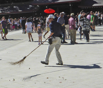 Sweeping the courtyard at Meji Shrine