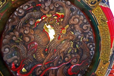 The wooden carving of a dragon on the bottom of the great red lantern on the Kaminarimon