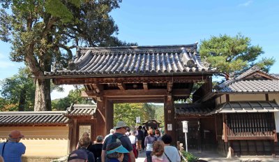 Entering the 'first gate' into grounds of Rokuon-ji Temple in Kyoto, Japan