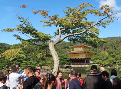 Rokuon-ji (officially) in Kyoto, Japan is known as Kinkakuji (the Golden Pavilion)