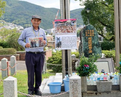  Man in Nagasaki Peace Park who miraculously survived the blast while working in the Mitsubishi Weapons Plant (.68 miles fro