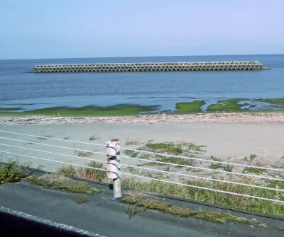 Storm surge breakwater barrier at beach north of Ibusuki, Japan