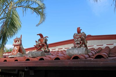 Shisas are placed on Ryukyu-style roofs to ward off evil