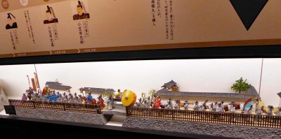 Miniature depiction of a celebration at Kokura Castle