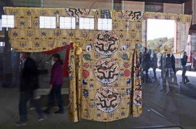 Ceremonial robe in the Hall of Heavenly Favors with characters for 'luck' and 'longevity'
