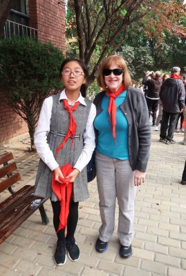 Susan with student who presented and tied her red scarf