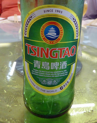 Tsingtao Beer bottle with Huilang Pavilion on the label
