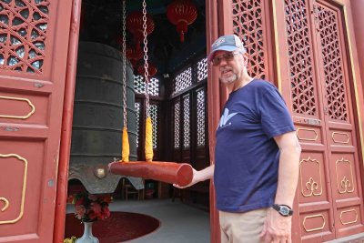 Bill ringing the Centennial Morning Bell at Zhanshan