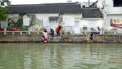 Doing laundry in the Grand Canal in Suzhou, China