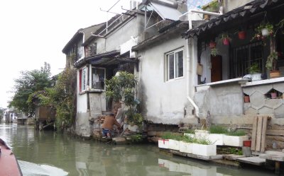 Gardening on the Grand Canal in Suzhou, China