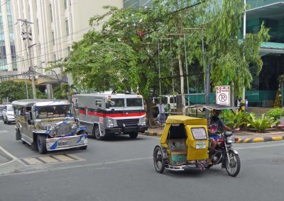 Jeepney and a Tuk Tuk in Manila