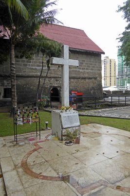 A white cross commemorates 600 victims of Japanese atrocities at Fort Santiago during WWII