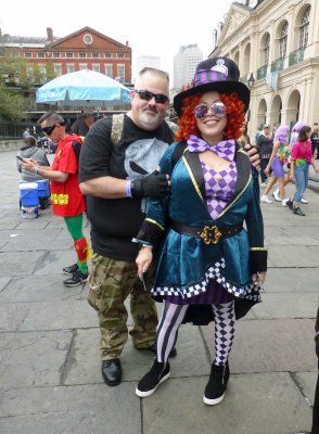 Robin on cellphone behind Punisher & Mad Hatter on Fat Tuesday