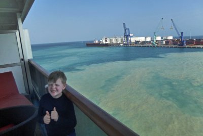 Ship's thrusters churning up silt docking at Progreso, Mexico