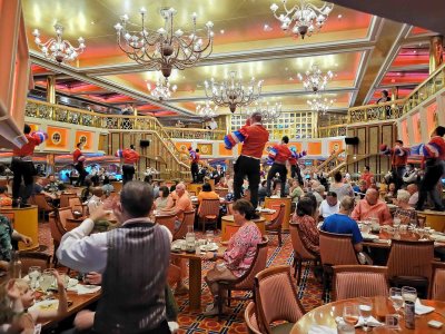 Waiters entertaining in Washington Dining Room