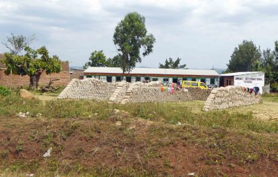 School clothes drying on stacks of bricks