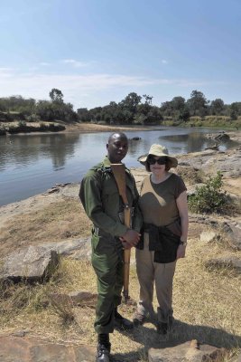 Susan with Ranger on the bank of the Mara River