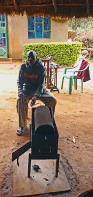 Coffee beans are roasted by turning the drum for 45 minutes over hot coals