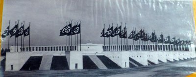 Photo of Nazi flags on 34 small building sdividing seating areas around Zeppelin Field