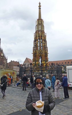 Enjoying deep-fried dough in Market Square in Nuremberg