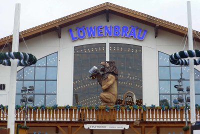 The animated Lowenbrau lion roars and drink his beer