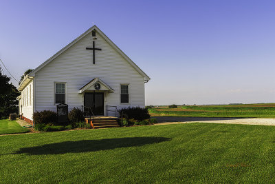 Next to this church is a sign marking the location of the Oaks School. Amid the countryside are still the artifacts of what built this country. The schools are long gone but there are still a few of the churches still in use. And they are well kept by the congregation. A close look and you can see the fields have been planted and are growing.

An image may be purchased at http://fineartamerica.com/featured/1-oaks-community-church-edward-peterson.html?newartwork=true