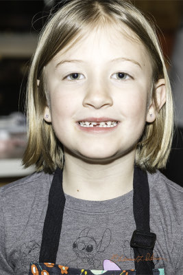 She got a cook book for Christmas and wanted to make something out of it. She made me some bread pudding missing her first tooth. It was excellent!
