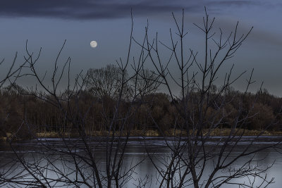 The temperature is dropping, the sun is setting and the moon is rising. At dusk things are becoming hidden and other things are becoming visible. Time to go home and get warm.

An image may be purchased at http://fineartamerica.com/featured/moon-rise-at-dusk-edward-peterson.html