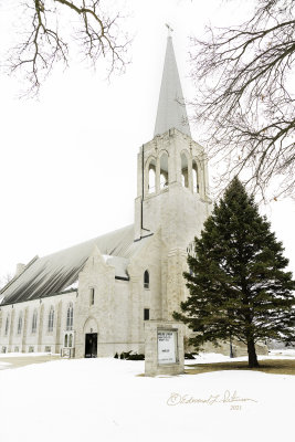 Taking a trip back to the old home town and I always look for this church steeple in the distance to know I am close. It sets high on a hill in Stanton, IA and at night the steeple is lighted. I've never been inside but would like to one day. It is a small and Swedish town that is known locally as The Little White City as all the houses are painted white. There are two water towers that are shaped like a coffee pot and a coffee cup since Mrs. Olson from the Folgers commercials, Virginia Christine, grew up here.

An image may be purchased at http://fineartamerica.com/featured/mamrelund-lutheran-church-edward-peterson.html