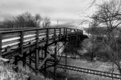 It has been a long time since any work has been done on this bridge. The rail line however has been reworked since it was install. Given the age of this bridge I just had to do a black and white since that it is how it would have been photographed when it was new.

An image may be purchased at edward-peterson.pixels.com/featured/wagon-bridge-over-rai...
