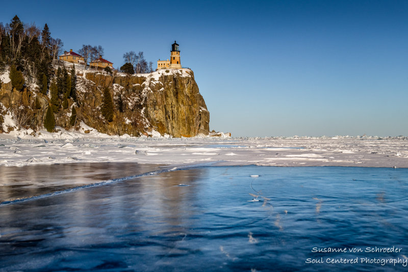 Lighthouse reflections in ice