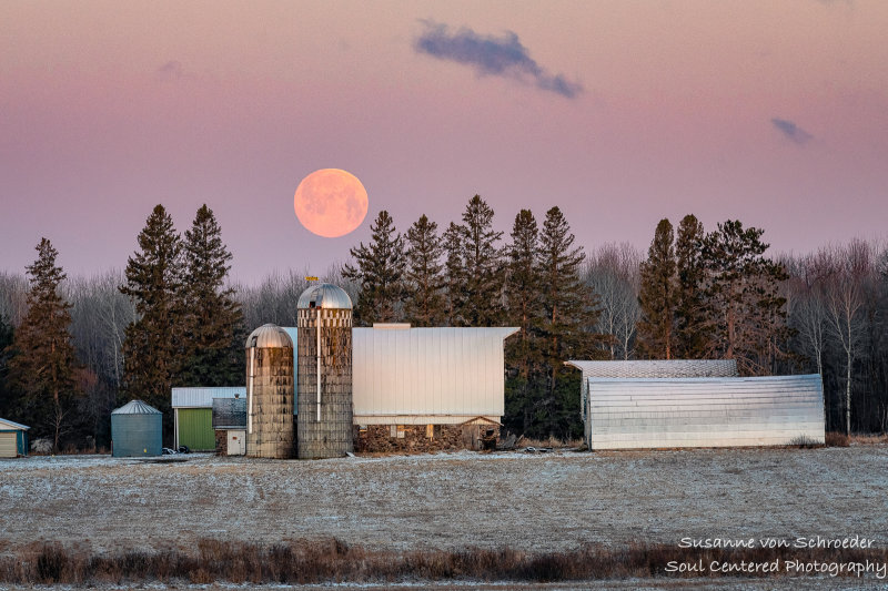 Full moon setting behind a farmstead 3