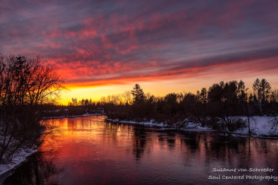 Fiery Sunset colors reflecting in the Chippewa river