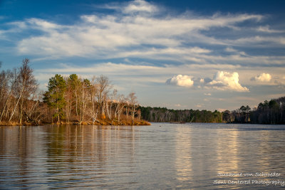 Spring landscape with clouds reflecting